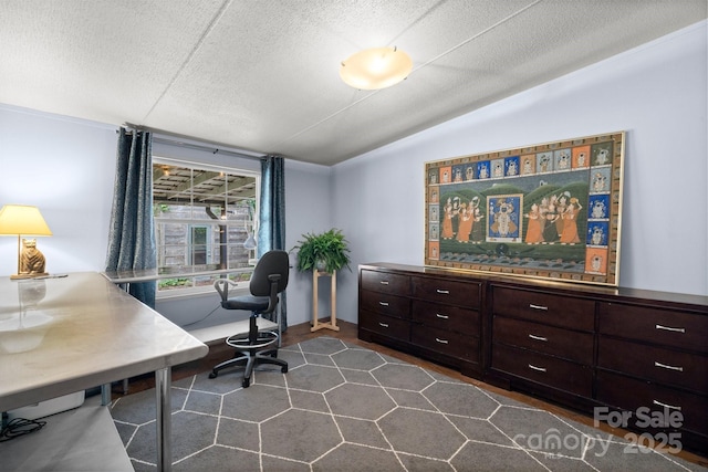 office area featuring vaulted ceiling and a textured ceiling
