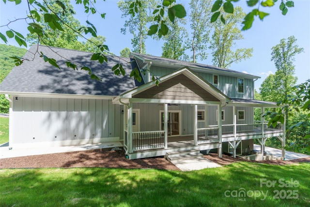 68 Bamboo Trl, Candler, NC 28715 - rear view of property featuring a lawn, a porch, and a shingled roof