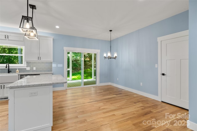 68 Bamboo Trl, Candler, NC 28715 - kitchen with a chandelier, plenty of natural light, light wood-style floors, and recessed lighting