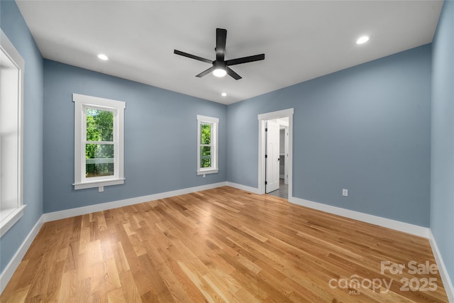 68 Bamboo Trl, Candler, NC 28715 - empty room with plenty of natural light, a ceiling fan, light wood-type flooring, and recessed lighting