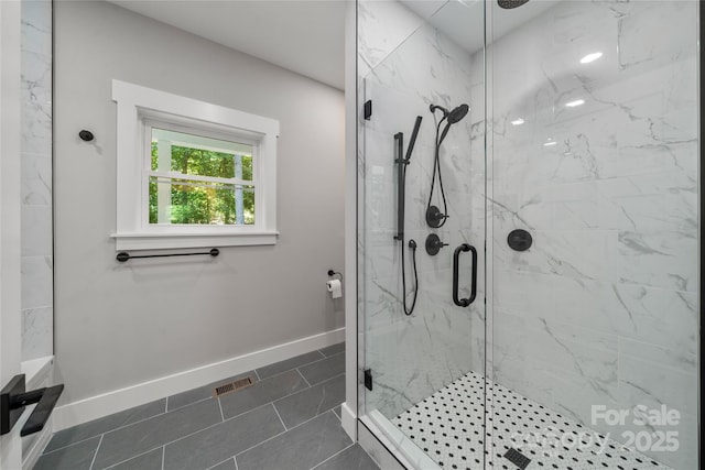 68 Bamboo Trl, Candler, NC 28715 - full bath with a marble finish shower, baseboards, and tile patterned flooring