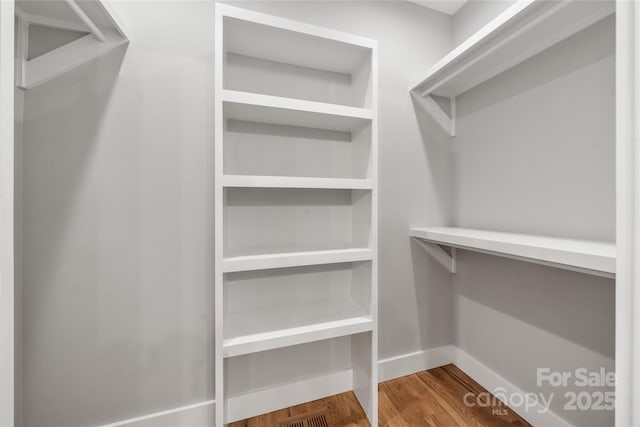 68 Bamboo Trl, Candler, NC 28715 - spacious closet with wood finished floors