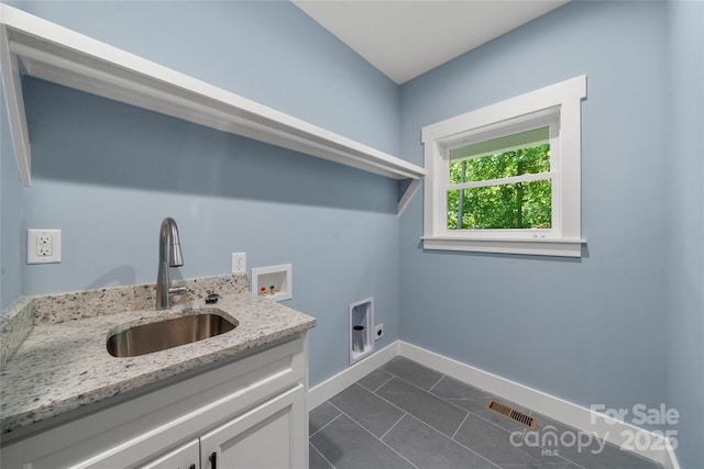68 Bamboo Trl, Candler, NC 28715 - laundry area featuring cabinet space, hookup for a washing machine, electric dryer hookup, and baseboards