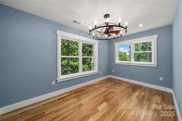 68 Bamboo Trl, Candler, NC 28715 - empty room with a chandelier, healthy amount of natural light, baseboards, and recessed lighting