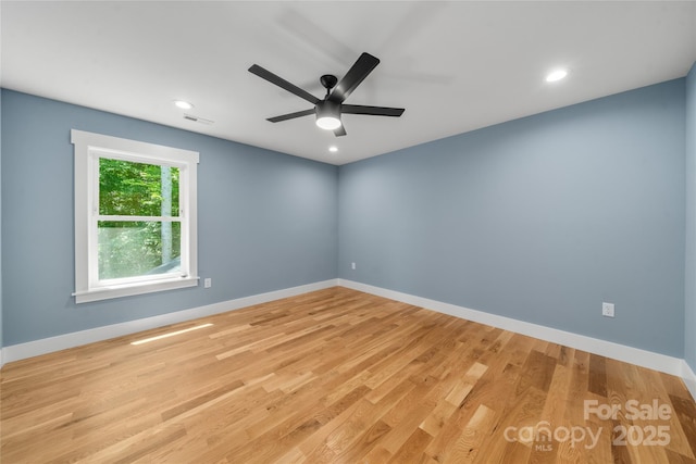 68 Bamboo Trl, Candler, NC 28715 - spare room featuring ceiling fan, light wood-type flooring, baseboards, and recessed lighting