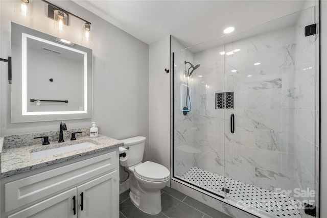 68 Bamboo Trl, Candler, NC 28715 - bathroom featuring a marble finish shower, toilet, vanity, and tile patterned flooring