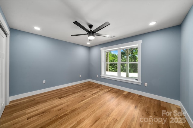68 Bamboo Trl, Candler, NC 28715 - unfurnished room featuring baseboards, ceiling fan, light wood-style floors, and recessed lighting