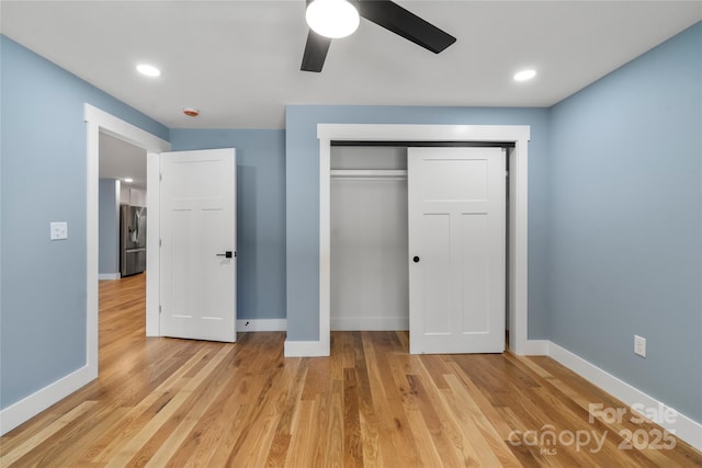 68 Bamboo Trl, Candler, NC 28715 - unfurnished bedroom with stainless steel fridge with ice dispenser, light wood-style flooring, baseboards, and recessed lighting