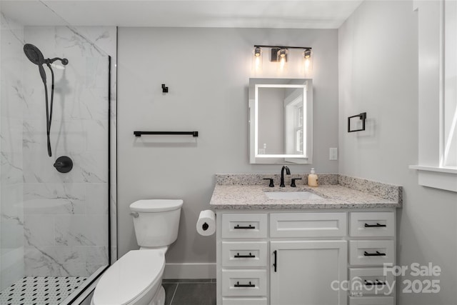 68 Bamboo Trl, Candler, NC 28715 - full bath featuring toilet, vanity, a marble finish shower, and baseboards