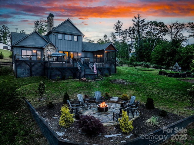 134 Olivia Trace Dr, Fletcher, NC 28732 - rear view of property featuring a fire pit, a wooden deck, a chimney, stairway, and a patio