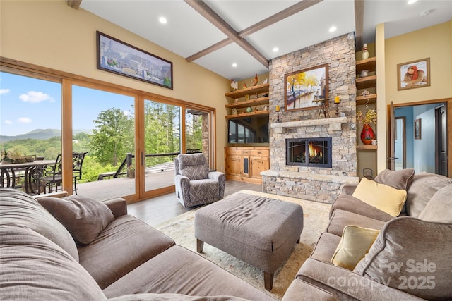 134 Olivia Trace Dr, Fletcher, NC 28732 - living area featuring beam ceiling, wood finished floors, a stone fireplace, recessed lighting, and built in shelves