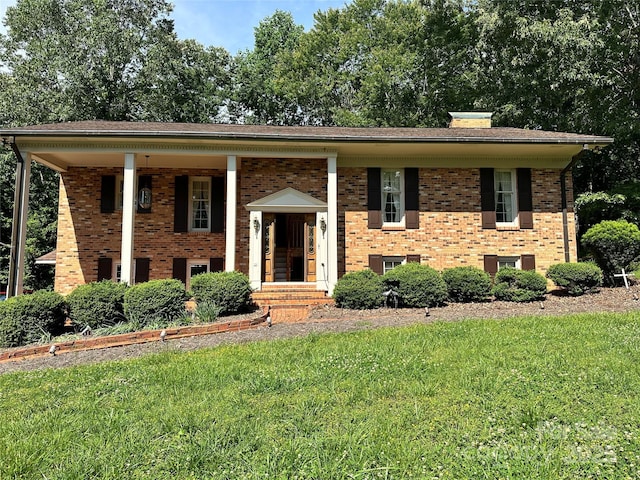 5495 Valley Run St, Hickory, NC 28601 - raised ranch with brick siding, a front yard, and a chimney
