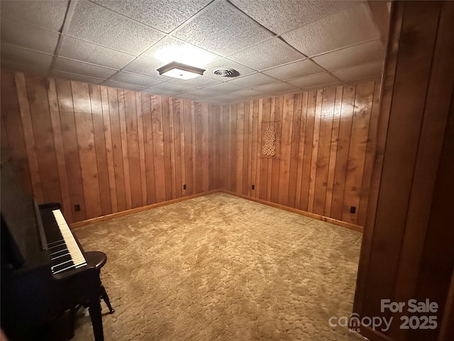 5495 Valley Run St, Hickory, NC 28601 - empty room with baseboards, carpet, a paneled ceiling, and wood walls