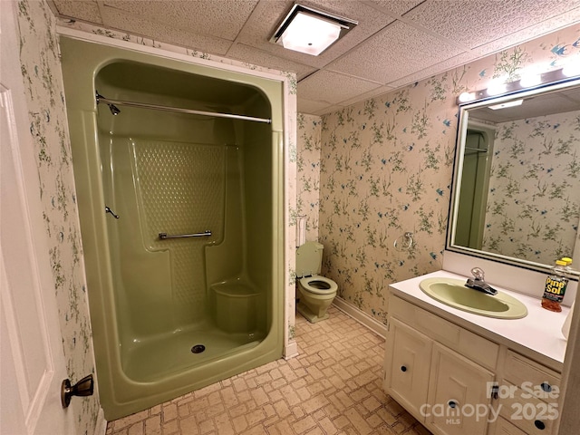 5495 Valley Run St, Hickory, NC 28601 - bathroom featuring a stall shower, toilet, vanity, brick patterned floors, and wallpapered walls
