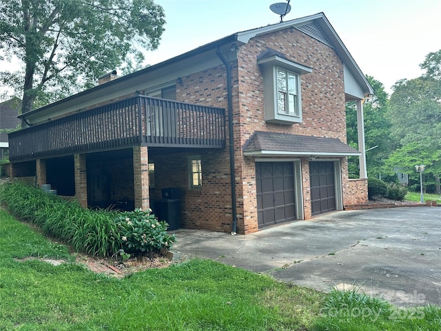 5495 Valley Run St, Hickory, NC 28601 - view of home's exterior with brick siding, a garage, driveway, and a deck