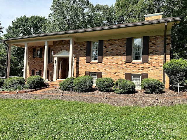 5495 Valley Run St, Hickory, NC 28601 - raised ranch with brick siding, a front yard, and a chimney