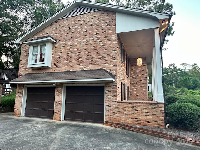 5495 Valley Run St, Hickory, NC 28601 - view of front facade with an attached garage, brick siding, and driveway