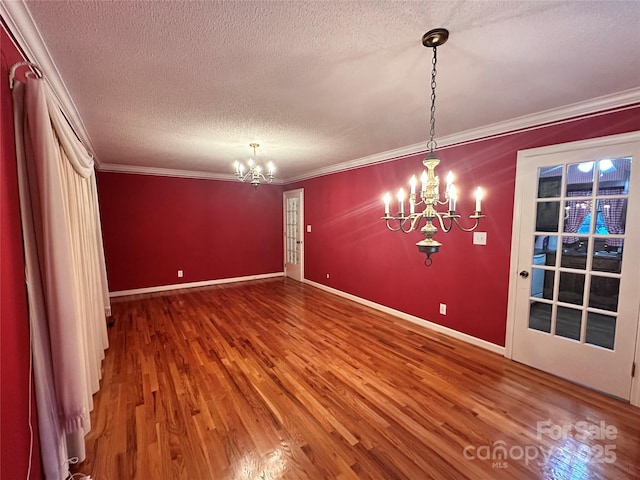 5495 Valley Run St, Hickory, NC 28601 - unfurnished dining area featuring a chandelier, a textured ceiling, wood finished floors, and crown molding