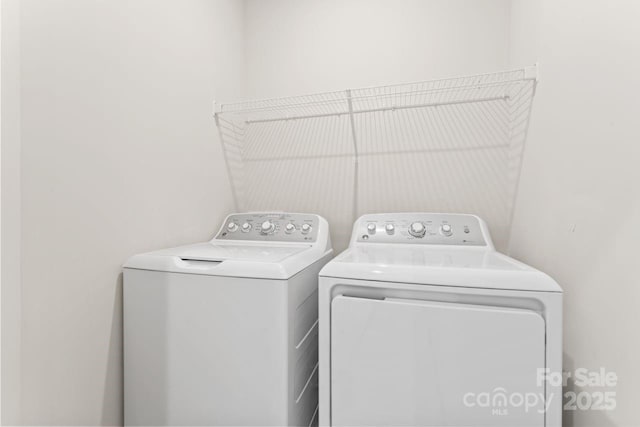 laundry room with independent washer and dryer