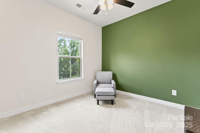unfurnished room with a ceiling fan, baseboards, and carpet floors