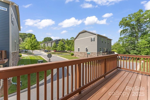 wooden terrace featuring a residential view