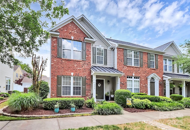 10378 Alexander Martin Ave, Charlotte, NC 28277 - view of property with brick siding and a standing seam roof