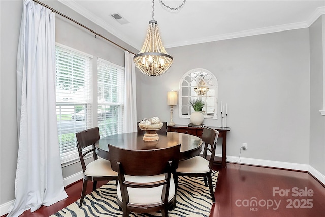10378 Alexander Martin Ave, Charlotte, NC 28277 - dining room with a chandelier, baseboards, wood finished floors, and crown molding