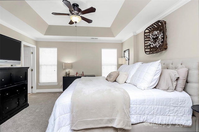 10378 Alexander Martin Ave, Charlotte, NC 28277 - bedroom with a tray ceiling, carpet flooring, multiple windows, crown molding, and a ceiling fan