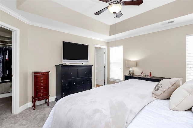 10378 Alexander Martin Ave, Charlotte, NC 28277 - bedroom featuring light colored carpet, a closet, a raised ceiling, baseboards, and a walk in closet
