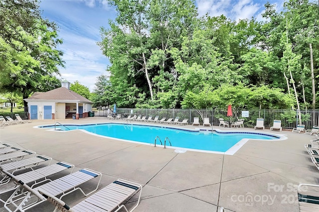 10378 Alexander Martin Ave, Charlotte, NC 28277 - community pool featuring fence, a patio, and view of scattered trees
