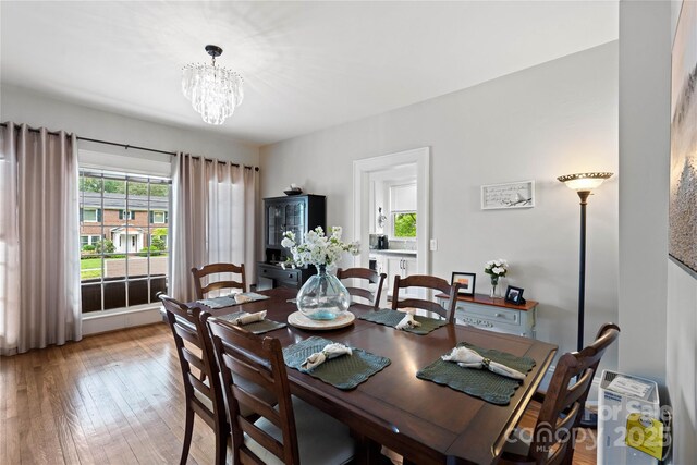 415 Norwood St SW, Lenoir, NC 28645 - dining room featuring light wood finished floors and a chandelier