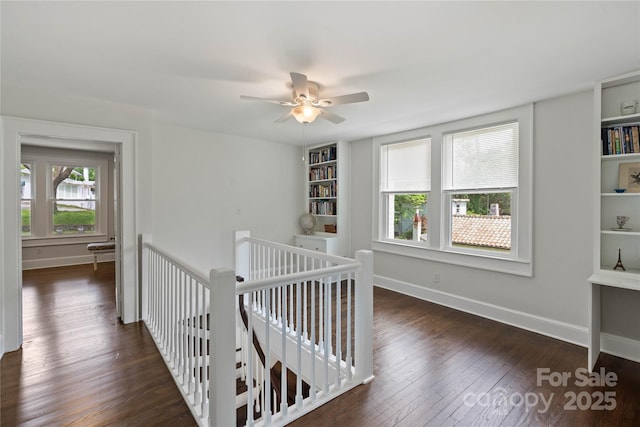 415 Norwood St SW, Lenoir, NC 28645 - hall featuring an upstairs landing, dark wood finished floors, and baseboards