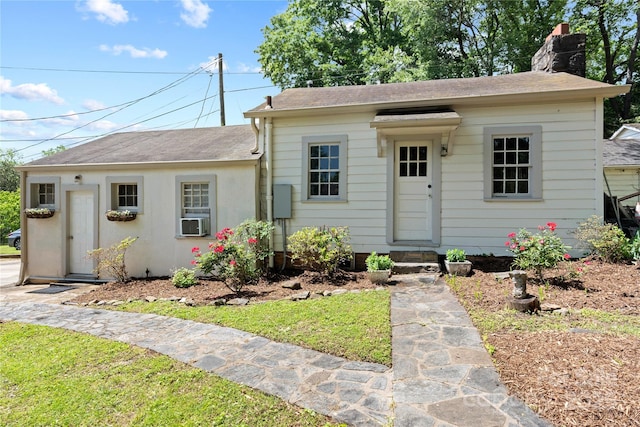 415 Norwood St SW, Lenoir, NC 28645 - view of front facade featuring a chimney, a shingled roof, cooling unit, and entry steps