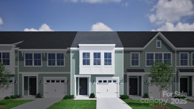 multi unit property with an attached garage, concrete driveway, and board and batten siding