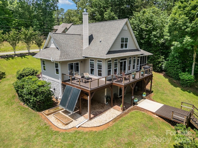 2845 Lakefront Dr, Belmont, NC 28012 - rear view of property with a deck, a yard, and a chimney