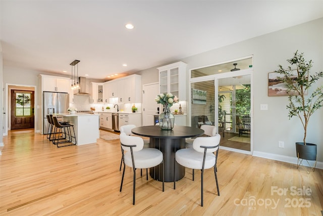 2845 Lakefront Dr, Belmont, NC 28012 - dining room with light wood finished floors, baseboards, recessed lighting, and ceiling fan