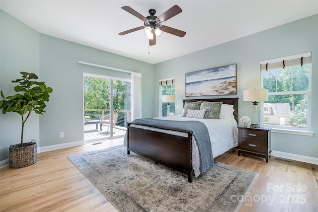 2845 Lakefront Dr, Belmont, NC 28012 - bedroom featuring access to exterior, baseboards, and wood finished floors