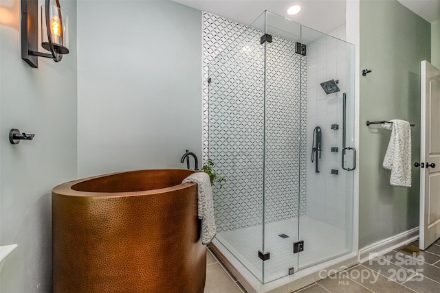 2845 Lakefront Dr, Belmont, NC 28012 - full bathroom with tile patterned flooring, a stall shower, a soaking tub, and recessed lighting