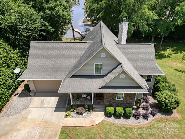 2845 Lakefront Dr, Belmont, NC 28012 - view of front of property featuring a garage, a chimney, a porch, concrete driveway, and a shingled roof
