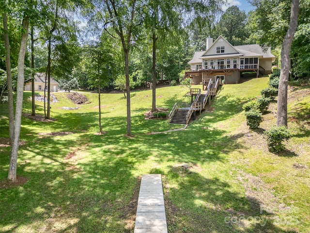 2845 Lakefront Dr, Belmont, NC 28012 - view of grassy yard with stairs, a wooden deck, and view of scattered trees