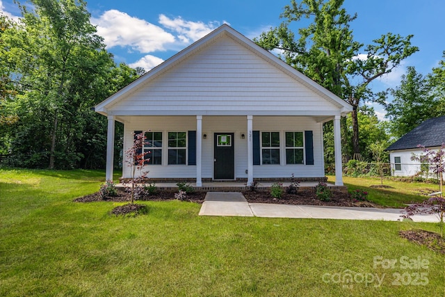 bungalow-style house with covered porch and a front yard