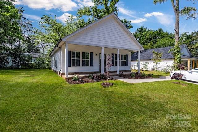 view of front of property featuring a front lawn and covered porch