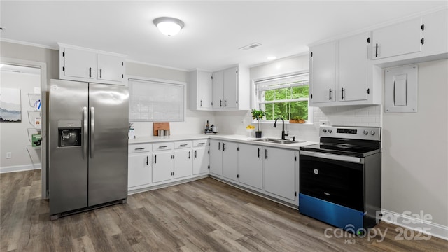 7860 Henry Harris Rd, Fort Mill, SC 29707 - kitchen with stainless steel appliances, a sink, decorative backsplash, light countertops, and ornamental molding