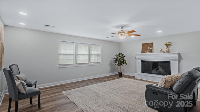 7860 Henry Harris Rd, Fort Mill, SC 29707 - living area featuring ceiling fan, wood finished floors, baseboards, a fireplace, and recessed lighting