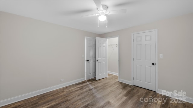 7860 Henry Harris Rd, Fort Mill, SC 29707 - unfurnished bedroom with wood finished floors, baseboards, a closet, and a ceiling fan