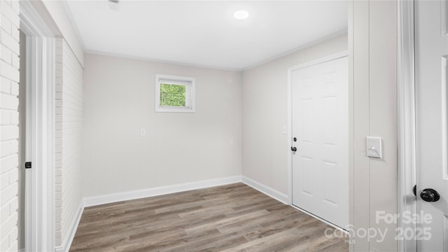 7860 Henry Harris Rd, Fort Mill, SC 29707 - unfurnished bedroom with wood finished floors, baseboards, and crown molding