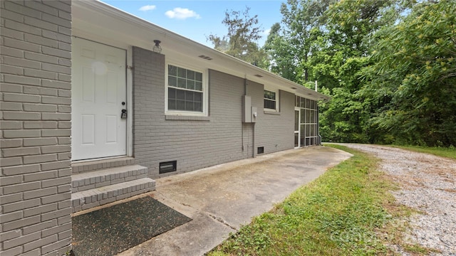 7860 Henry Harris Rd, Fort Mill, SC 29707 - entrance to property featuring crawl space, brick siding, and a patio area