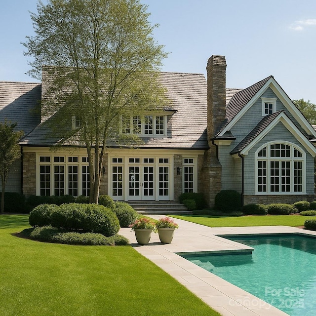 21121 Shearer Rd, Davidson, NC 28036 - rear view of property featuring french doors, a yard, an outdoor pool, and stone siding