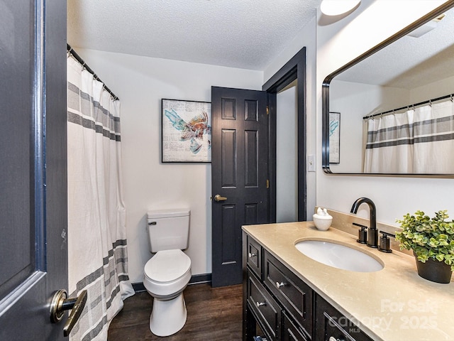 100 Willow Run Dr Unit 26, Gastonia, NC 28056 - full bathroom with wood finished floors, toilet, vanity, a textured ceiling, and a shower with shower curtain