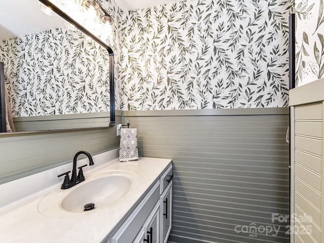 100 Willow Run Dr Unit 26, Gastonia, NC 28056 - bathroom featuring wallpapered walls, vanity, and a wainscoted wall
